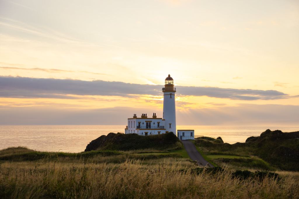 A lighthouse on the coast at dusk