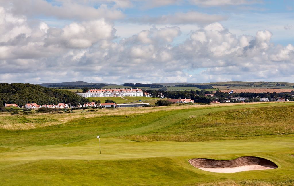 A links course with the resort on the hill behind