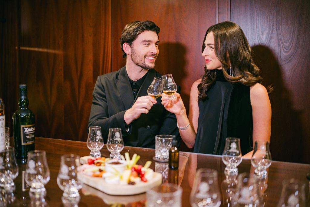 A couple sharing a whisky toast