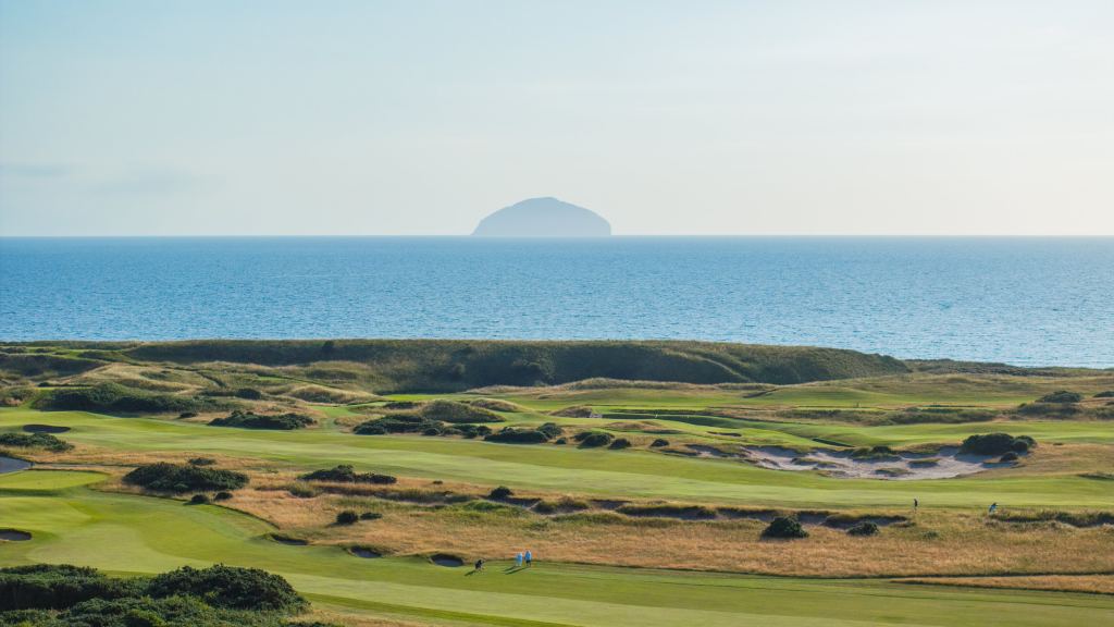 A links course above the sea with Ailsa Craig in the distance