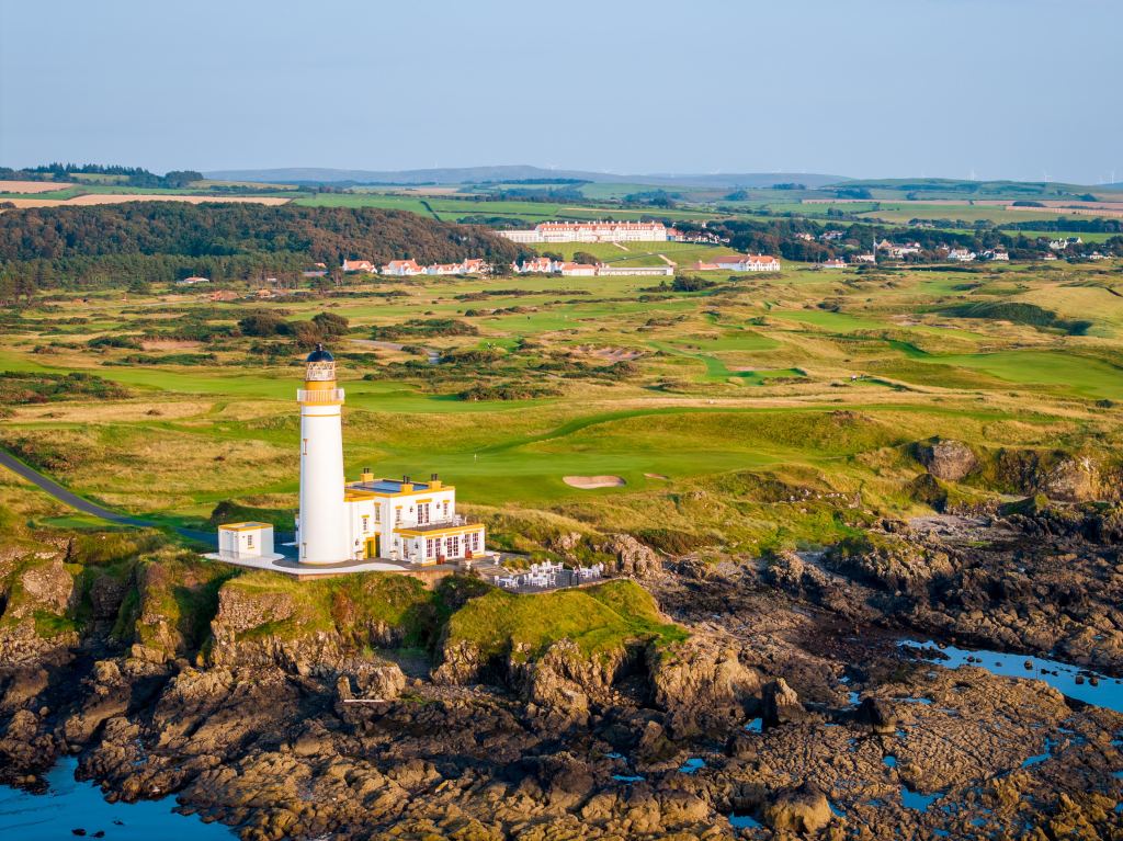 Aerial view of the lighthouse with the resort beyond
